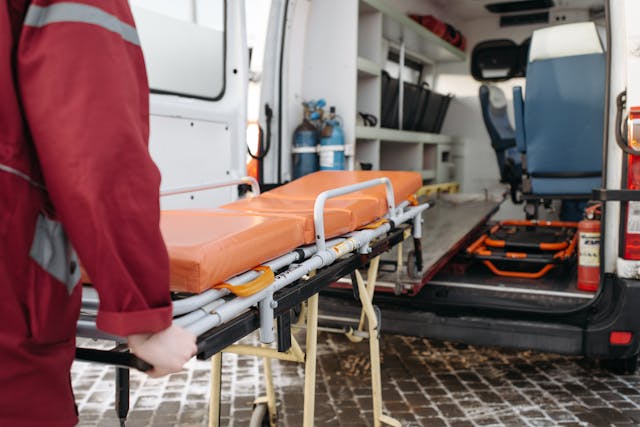 EMT pulling stretcher out