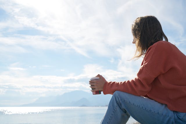 person sitting solemnly